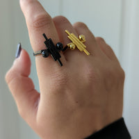 Two Balance Rings_Black balance ring on index finger